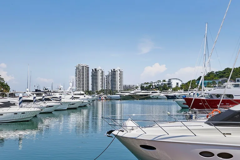 Cape Royale, photograph: the towers seen across the moored yachts of the marina at Sentosa Cove on a clear day