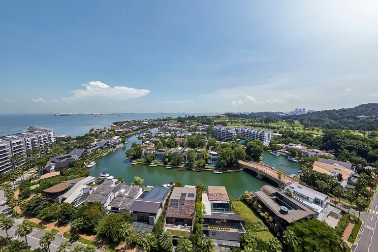 Cape Royale, photograph: the rear outlook from a high floor over the waterfront houses and canals of Sentosa Cove, the golf course and the city skyline